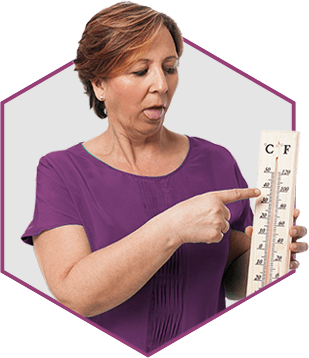 Woman holding a thermostat